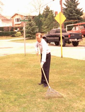 Andrew rakes some imaginary leaves.